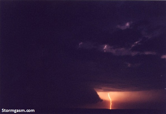 Wall cloud illuminated by lightning from a supercell in extreme southern Kansas on April 17, 2002. Wall cloud illuminated by lightning from a supercell in extreme southern Kansas on April 17, 2002.